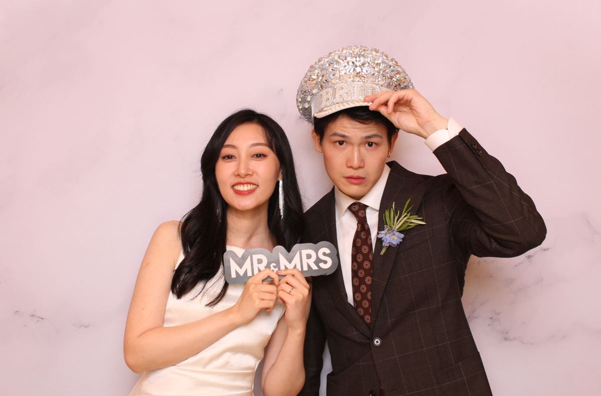 photo booth at a wedding with bride and groom