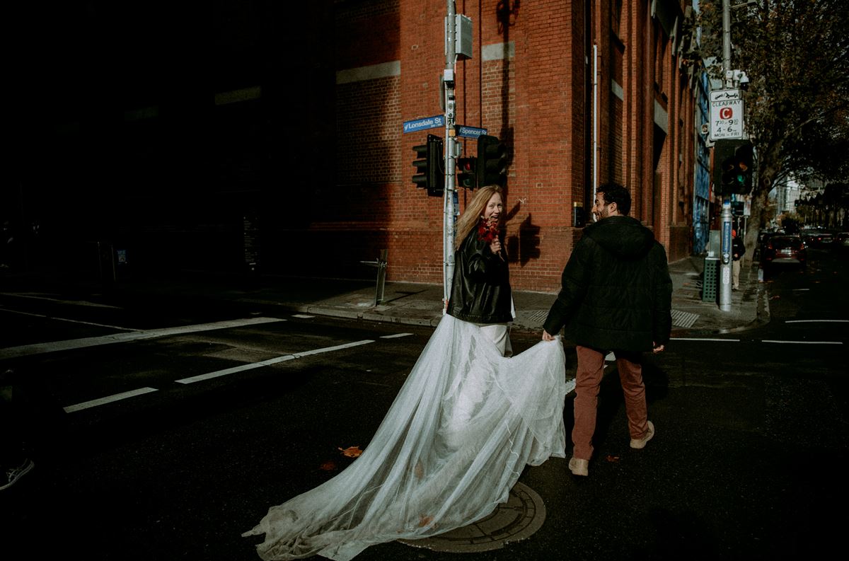 wedding dress in rain and leather jacket