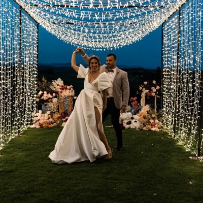 wedding decorations couple under festoon lights