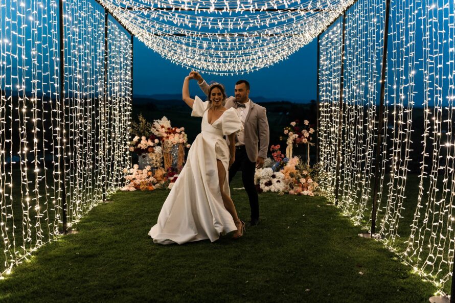 wedding decorations couple under festoon lights