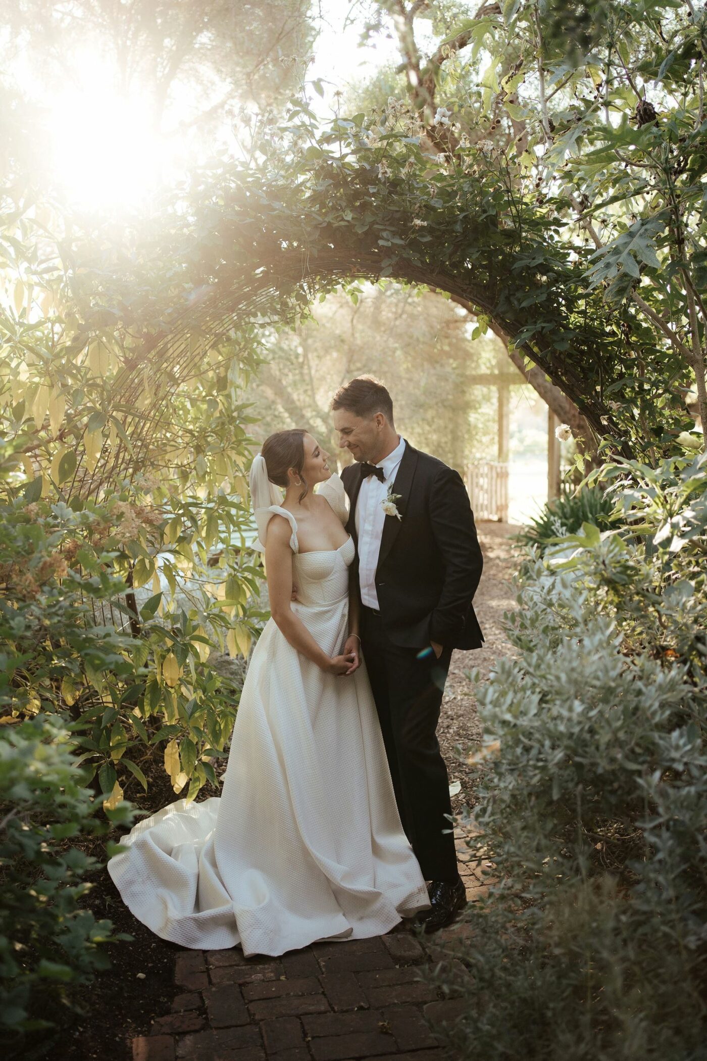 couple under garden pegola