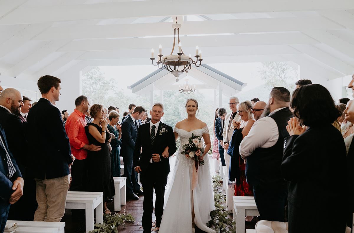 father walking daughter down teh aisle