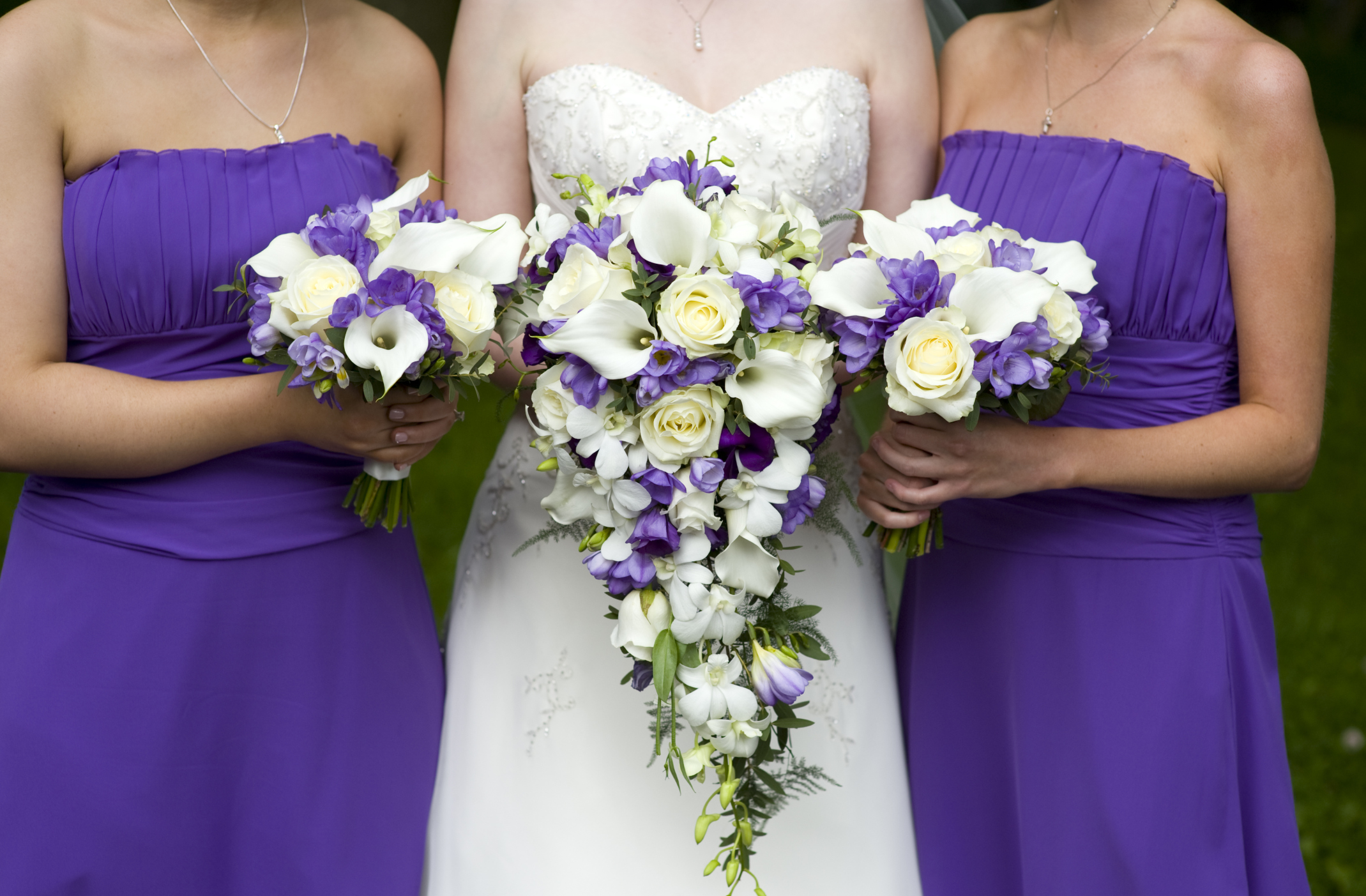 purple bridesmaids and bouquets