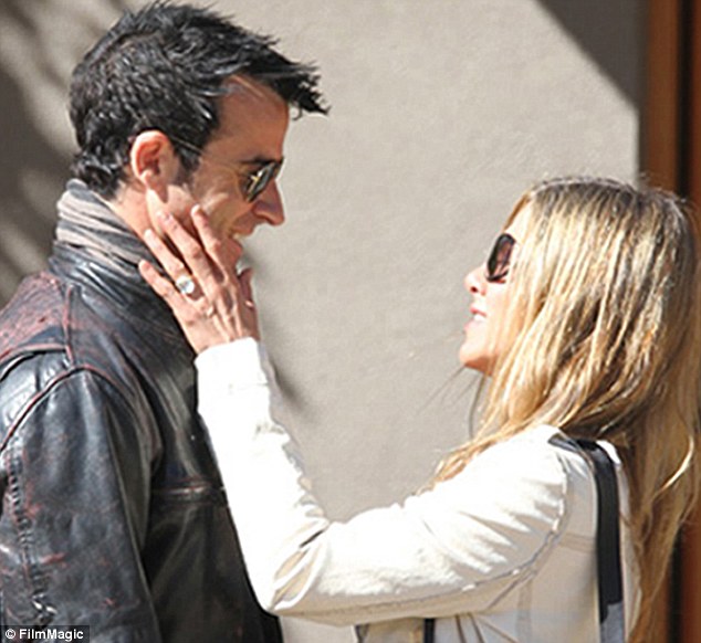 Jen's engagement ring is unmissable as she stroke's fiance Justin Theroux's cheek. Image: FilmMagic