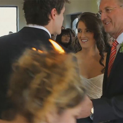 Photographer Jacki Bruniquel’s hair is set alight while shooting a wedding ceremony