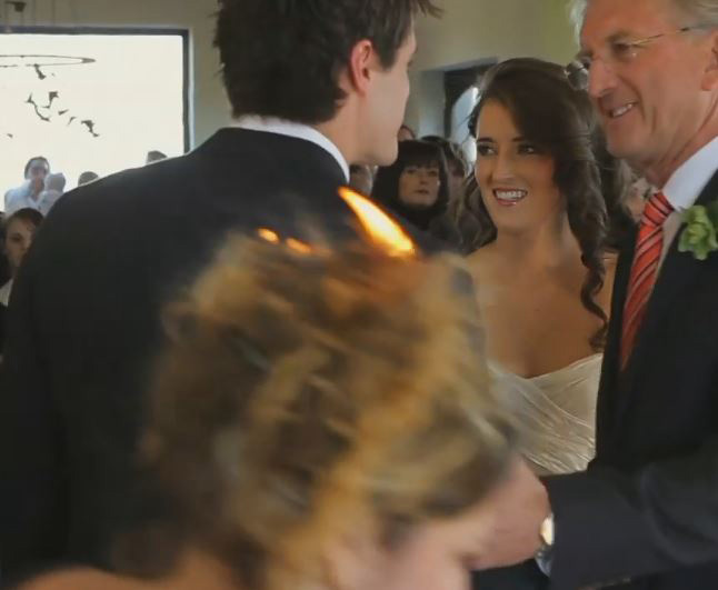 Photographer Jacki Bruniquel’s hair is set alight while shooting a wedding ceremony