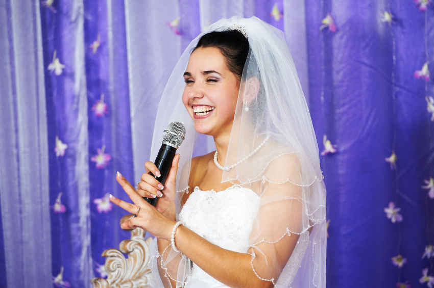 Joyful bride speaks at banquet on her wedding