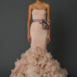 The petal-coloured Holly is a sculpted mermaid gown by Vera Wang.