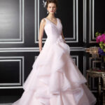 This Jasmine Couture tulle and poly satin skirt length gown features a Tiffany train.
