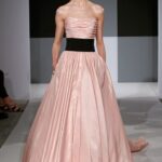 From Isaac Mizrahi's 2012 collection, this simple and elegant pink wedding gown boasts a striking black sash.