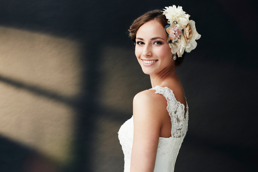 Glamorous young bride in wedding dress, smiling