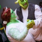 Mr and Mrs Bellas/Shrek cut their wedding cake