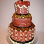 A white chocolate mud wedding cake containing solid white chocolate skulls by English food artist Annabel Vetten