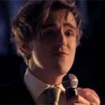 One of Tom's bandmates (and a groomsman) reacts to a line in his medely thanking them