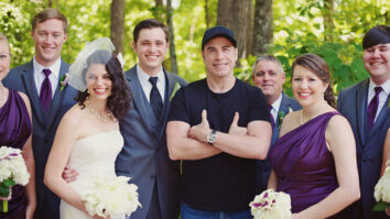 John Travolta takescentre stage in the wedding photos
