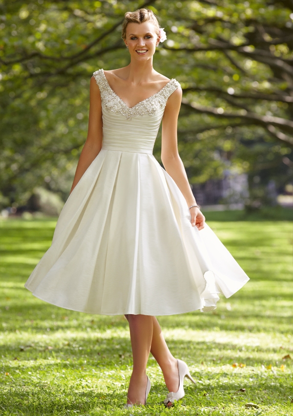From Madeline Gardner's Morilee collection, this taffeta wedding gown may be short, but it's still very, very romantic and the ivory coloring is perfect and elegant. You may not even need any accessories, well, except for your wedding band.