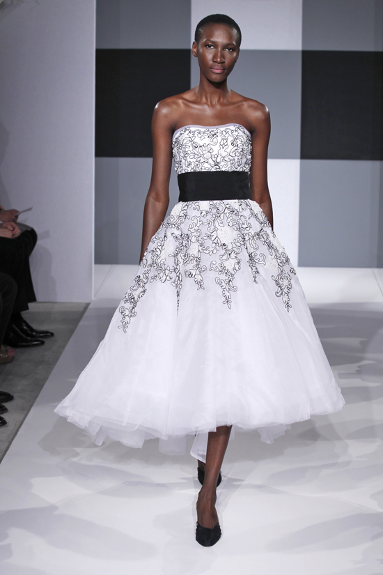 Isaac Mizrahi's 2013 bridal collection is full of surprises including this very sweet black and white gown. It works surprisingly well being delicate and feminine, yet also showing a bit of urban attitude. LOVE it!