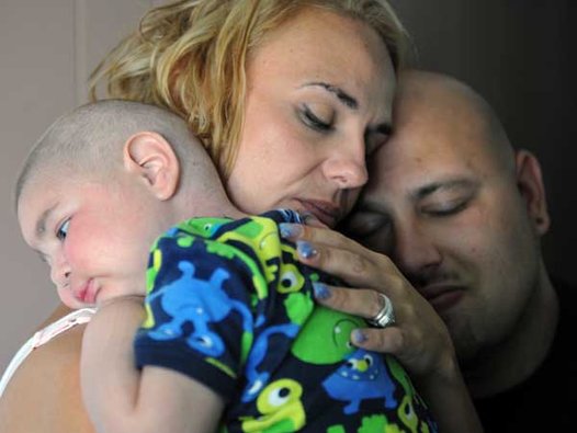 In one of their final photos together, Christine Swidorsky and Sean Stevenson  hold their sleeping son. Image:  AP Photo/Tribune-Review, Eric Schmadel