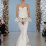 Anastasia: Ivory bouquet corded Chantilly lace sweetheart peplum gown with ivory silk faille trumpet skirt. Oscar de la Renta.