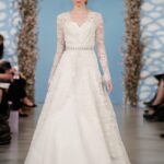 Alicia: Ivory silk faille sweetheart gown with ivory floral corded Chantilly lace overlay. Oscar de la Renta.