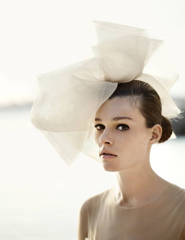 It may not be a hat, but this giant bow is certainly a striking headpiece for a bride