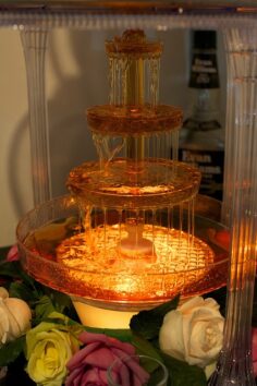 Architectural food artist Sam Bompas with the whisky fountain he has created for the Johnnie Walker marquee at the 2013 Melbourne Cup. Image: Sydney Morning Herald
