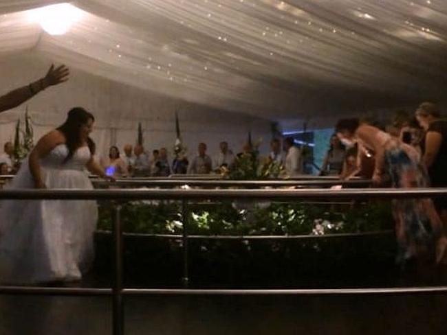 Wedding guest dives over balcony to catch bouquet 