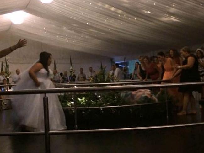 Wedding guest dives over balcony to catch bouquet 
