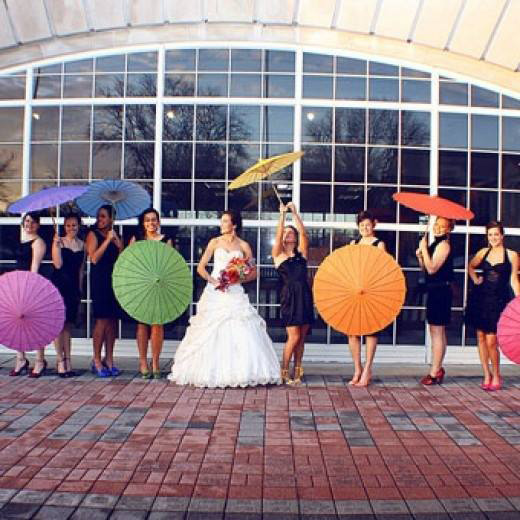 brides pose with parasols