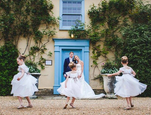 intimate wedding shot with ballerina flower girls