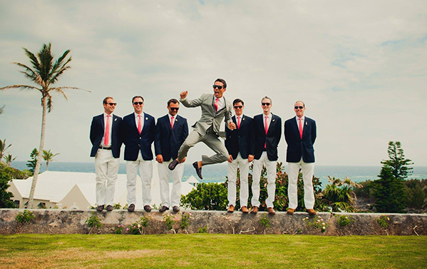 groom jumping and groomsmen
