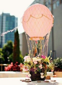 flowers haning on helium balloons