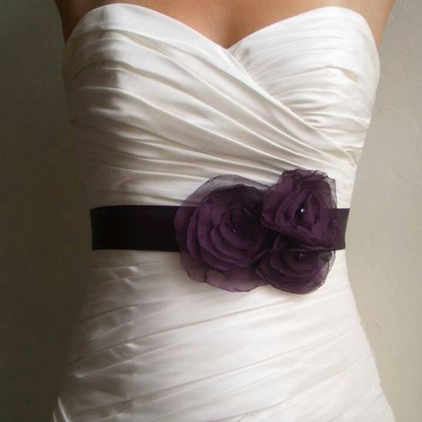 purple floral details on a wedding dress