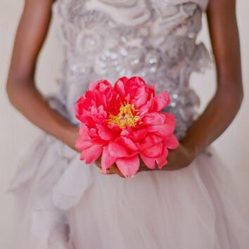 bride holding a giant flower
