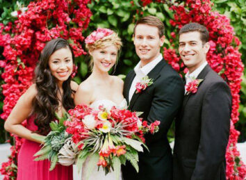 bridal party and red roses