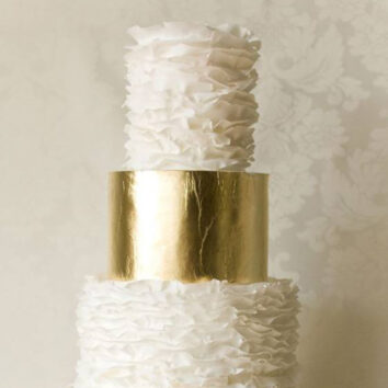 ruffled wedding cake with golden bands