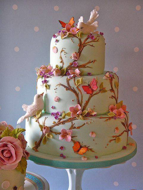 spring wedding cake with birds and flowers