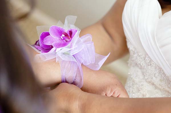 A corsage worn by a bridesmaid