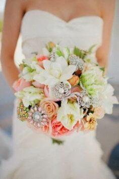 wedding bouquet of real flowers and brooches