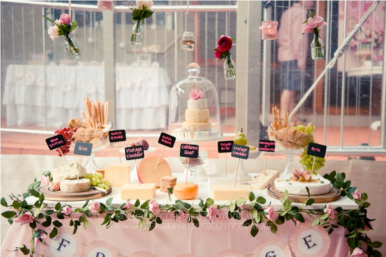 You’ve heard of a sweets table surrounding the wedding cake, now discover the cheese version for lovers of savoury treats. Image: Styled By Belle
