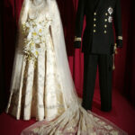 Princess Elizabeth's wedding dress and Lieutenant Philip Mountbatten's uniform on display at a London exhibition celebrating their 2007 Diamond wedding anniversary