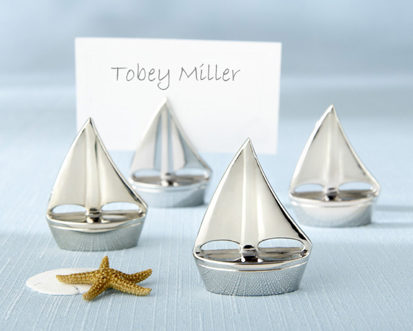 While we love the humble sugared almond as bomboniere/favours, there are plenty of alternatives, including these gorgeous silver sails placecard holders