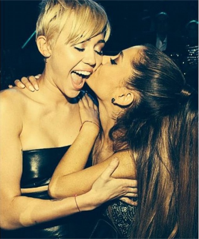 Ariana Grande's peck on Miley Cyrus' cheek was the third most popular image on Instagram in 2014