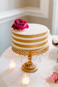 Gold banded wedding cake