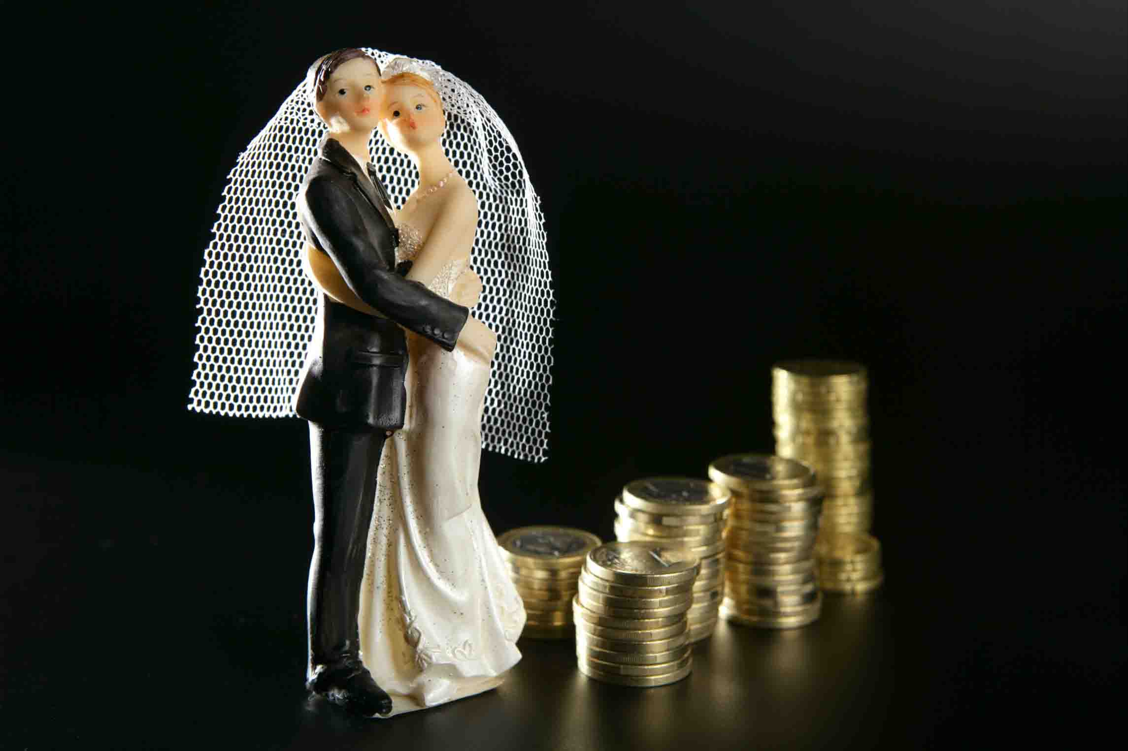 wedding couple figurine and golden coins
