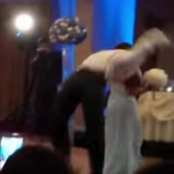 Groomsman backflips bridesmaid