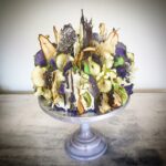 Layers of spiced carrot, pecan & cardamom sponge, drizzled with orange syrup, layered with fresh passion fruit, seville marmalade, toasted sunflower seeds & vanilla bean buttercream. Decorated with painterly chocolate foliage & dip dye fruity flora. Image: The Bakemongers