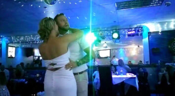 groom cant resist watching the rugby - during his first dance at his wedding