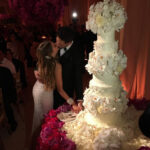 The love up couple pause to kiss during the cutting of the cake. Image Sofia Vergara via Instagram