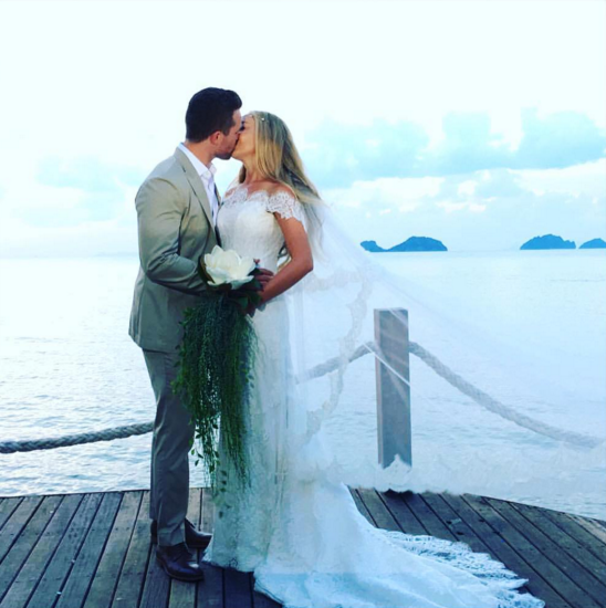 Jessica and Dean share a kiss on their wedding day. Image: Jessica Sepel via Instagram